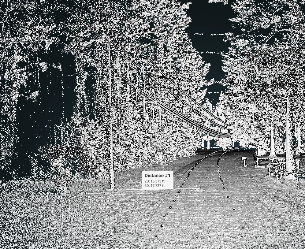 Black-and-white mobile LiDAR point cloud with a roadway distance measurement